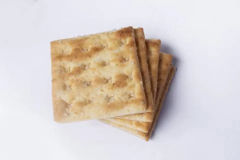 Golden Crispy Crackers Stack on White Stock Photos