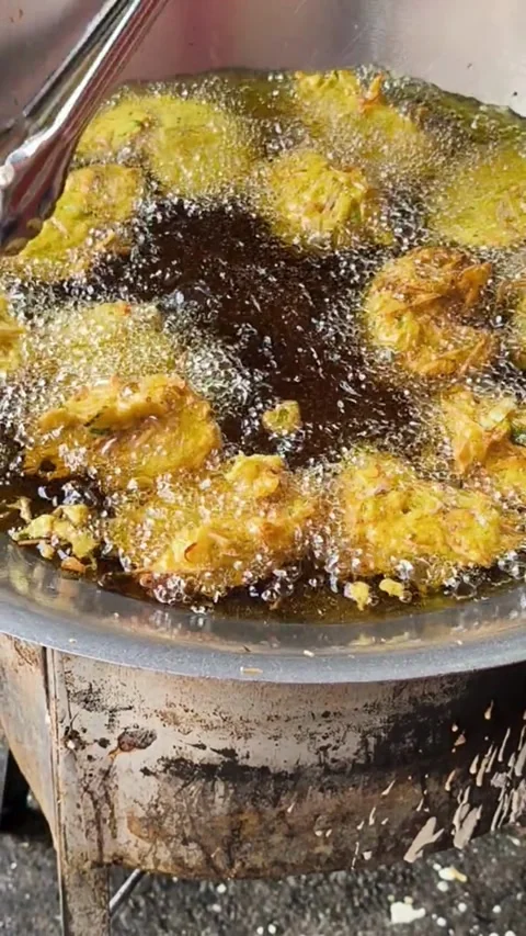Golden crispy cucur deep fried to perfection traditional Malaysian snack Stock Footage 319004939