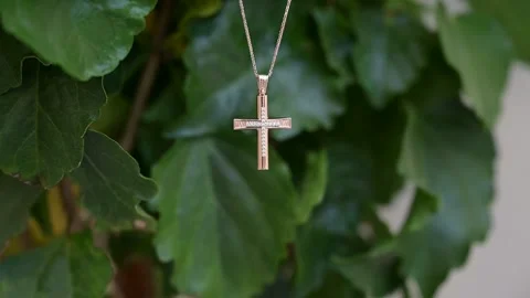 Golden cross on a chain Video stock 264061526