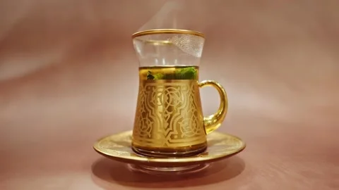 Golden cup of Arabean Mint Tea Stock-Footage 182995259