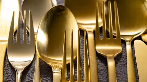 Golden Cutlery Set, Elegant Table Setting Close-Up Stock Footage 340550247