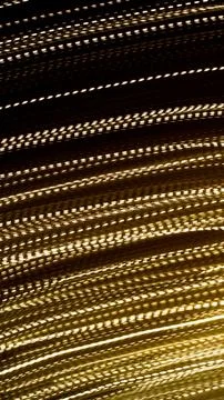 Golden dashed lines of lights on black background Stock Illustration