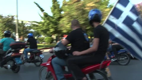 Golden Dawn mottorcade with flags-- Stock Footage 148409237