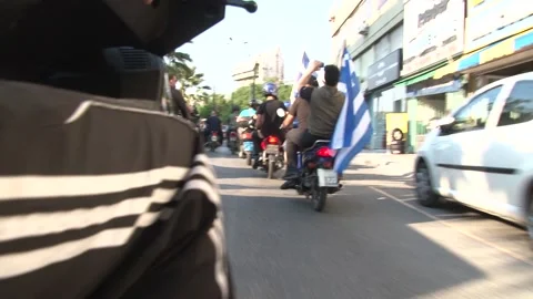 Golden Dawn mottorcade with flags- Stock Footage 148409960