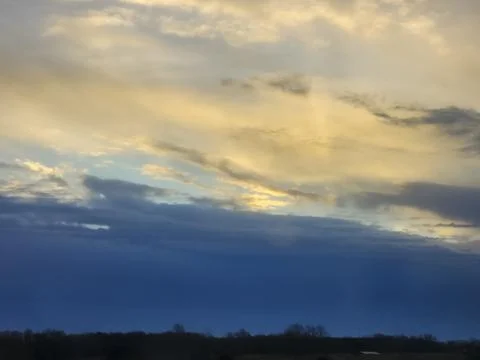 Golden Dawn: Rays of Light Breaking Through Stock Photos