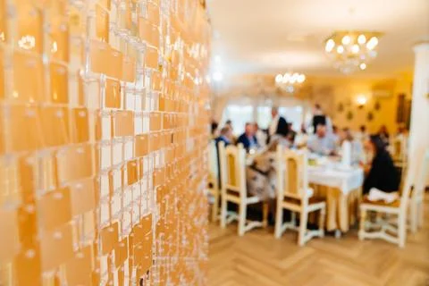 Golden decorative panel with sequins in the background of the restaurant Stock Photos