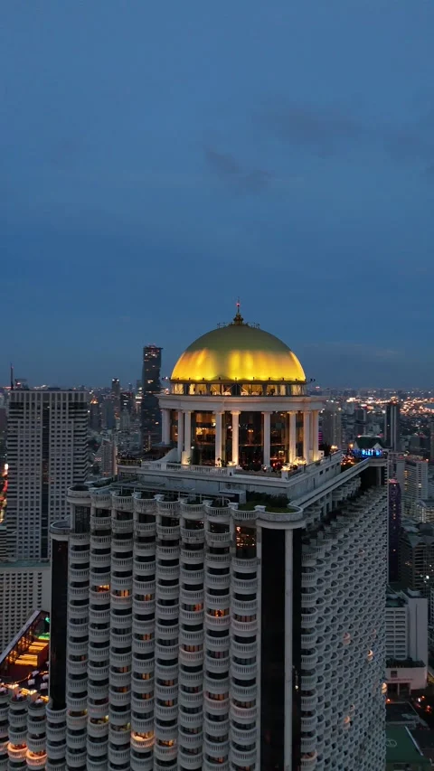 Golden Dome Skyscraper Rooftop Bar Overlooking Bangkok, Thailand at Night Stock Footage 335839515