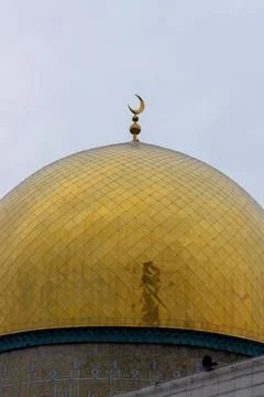 Golden Dome Under the Celestial Sky: A Glimpse of Spiritual Architecture Re.. Stock Photos