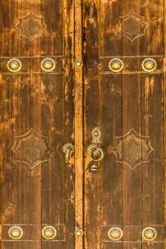 The golden door handles of old brown door Stock Photos