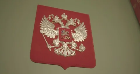 Golden double-headed eagle on a red background Stock Footage 121336068