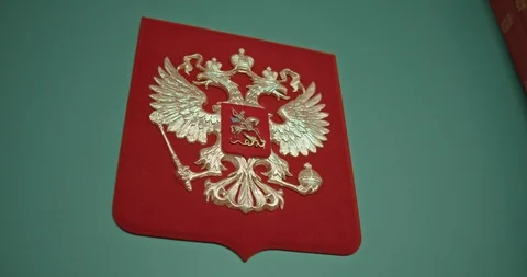 Golden double-headed eagle on a red background Stock Footage 121336102