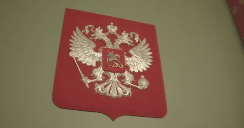 Golden double-headed eagle on a red background Stock Footage 121336748