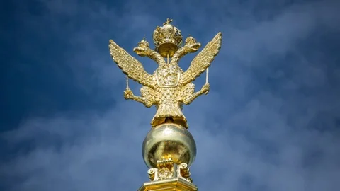 Golden Double-headed eagle on sky static time lapse Stock-Footage 84566628