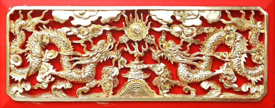 Golden dragon(chinese: long) wood carving in red background Stock Photos