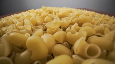 Golden dry pasta extremely close-up in macro mode linear movement. Stock Footage 211399288