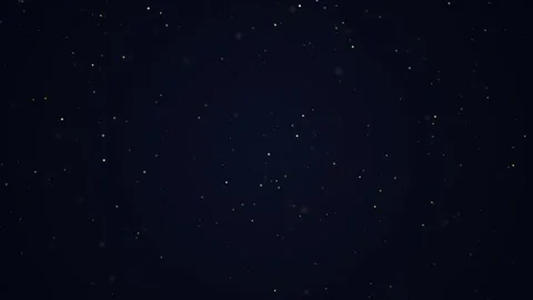 Golden dust particles float gently against dark night sky background seamle.. Видео 341684838