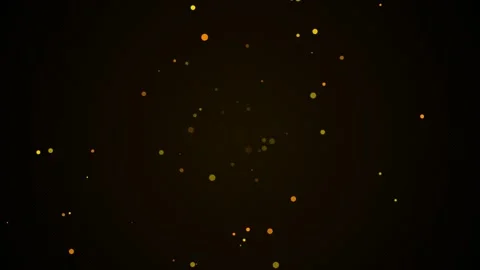 Golden dust particles float gently against a dark textured background Stock Footage 345617693