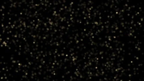 Golden dust particles floating on black background seamless loop 4K Stock Footage 342301380