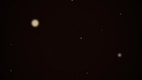 Golden Dust Particles Floating in Dark Ambient Space with Cinematic Light Glo Video stock 344291093