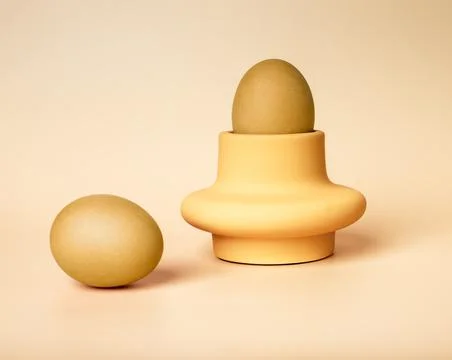 Golden dyed Easter eggs in server and on beige background. Nutritious healthy Stock Photos