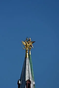 A golden eagle and a Soviet ruby star Stock Photos
