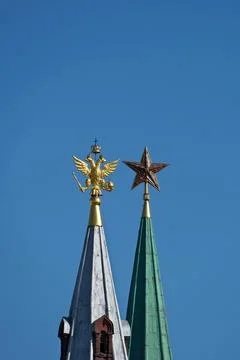 A golden eagle and a Soviet ruby star Stock Photos