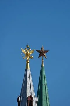 A golden eagle and a Soviet ruby star Stock Photos
