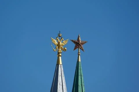 A golden eagle and a Soviet ruby star Stock Photos