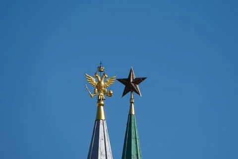 A golden eagle and a Soviet ruby star Stock Photos