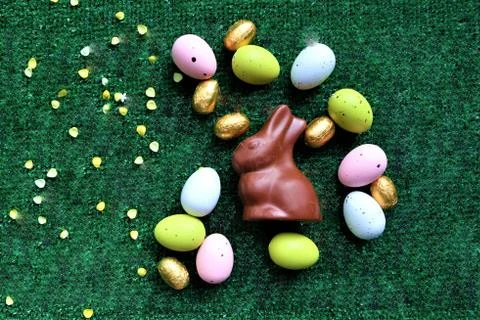 Golden Easter eggs on a green background Stock Photos