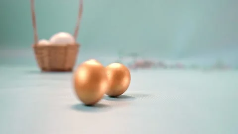 Golden Easter eggs on a light blue background. Happy Easter. Stock Footage 170495744