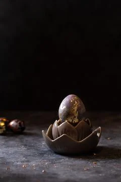 Golden egg. Easter golden egg in nest. Easter egg decoration with patina Stock Photos