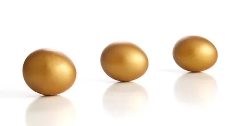 Golden egg on a white background Stock Photos