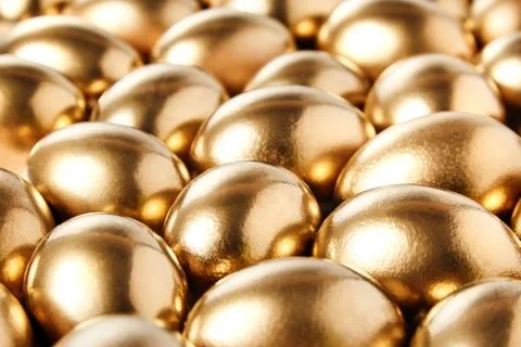 Golden eggs, background. Selective focus Stock Photos
