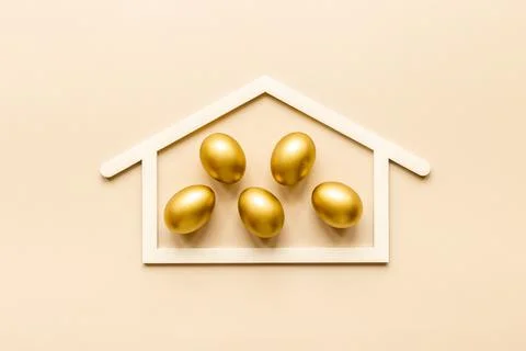 Golden eggs flat lay. Save money. Wealth and good luck symbol Stock Photos