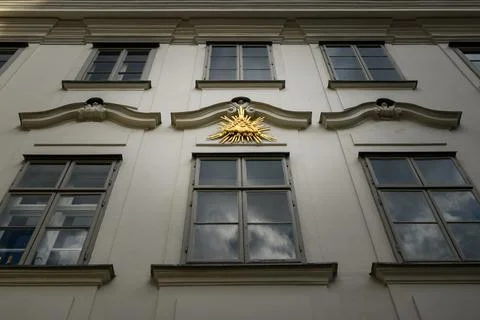 Golden element over a window of an old building in Vienna, Austria Stock Photos