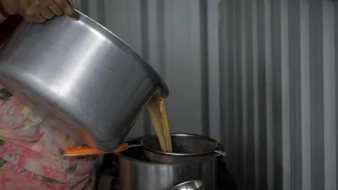 Golden Elevated Steaming - Indian Style Coffee or Tea Making Process Stock Footage 315862373