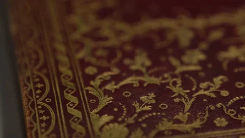 Golden embossing of floral pattern on leather cover of folio Stock Footage 177965844