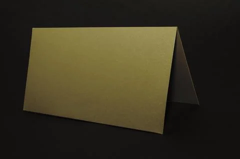 Golden envelope on a black flat background, luxury corporate identity and cor Stock Photos