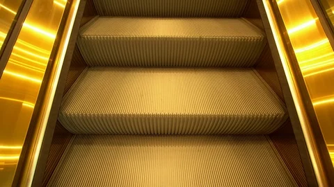 Golden escalator in building Stock Footage 100276980