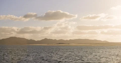 Golden Evening Light Over Remote Mountain Coastline in Magdalena Bay, Mexico Stock Footage 341640269