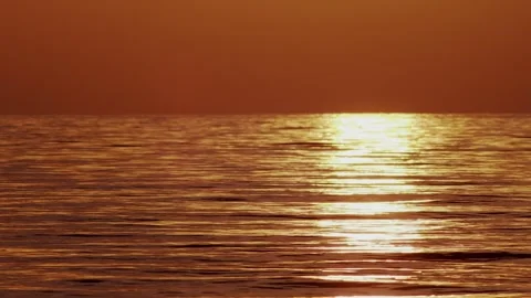 Golden Evening Reflection Across Calm Ocean Surface Stock Footage 340440655