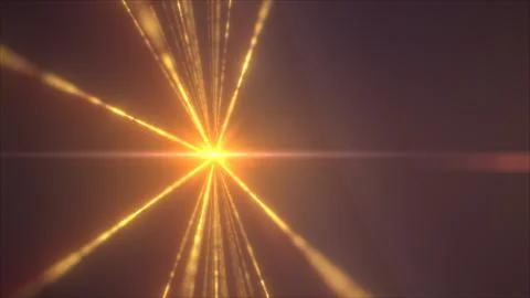 A golden explosion of light rays bursts outward in a radial pattern from a ce Stock Photos