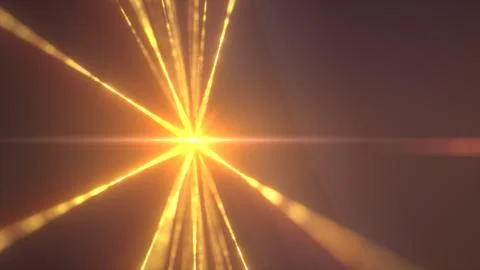 A golden explosion of light rays bursts outward in a radial pattern from a ce Stock Photos