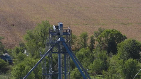 Golden Fields and Wooded Edges Near Grain Elevator, Aerial Stock Footage 323873020