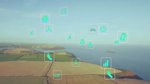 Golden fields merging into blue sea, floating green icons highlighting renewable Stock Footage 308206938
