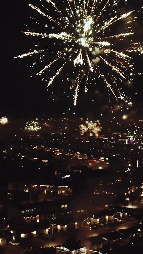 Golden Fireworks Explode Over City on New Year's Eve 動画素材 340878774