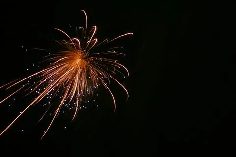 Golden Fireworks Exploding Against Black Night Sky with Copy Space Stock Photos