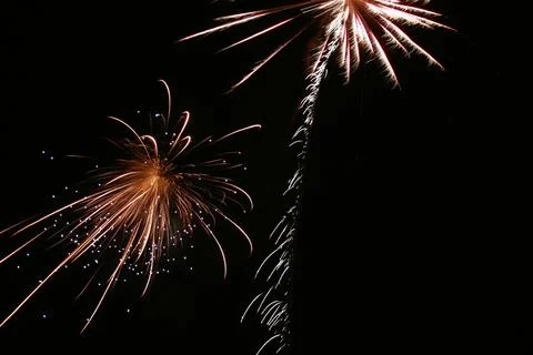Golden Fireworks Exploding Against Black Night Sky with Copy Space Stock Photos