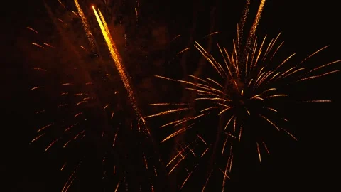 Golden fireworks exploding in the dark night sky Video stock 343160351